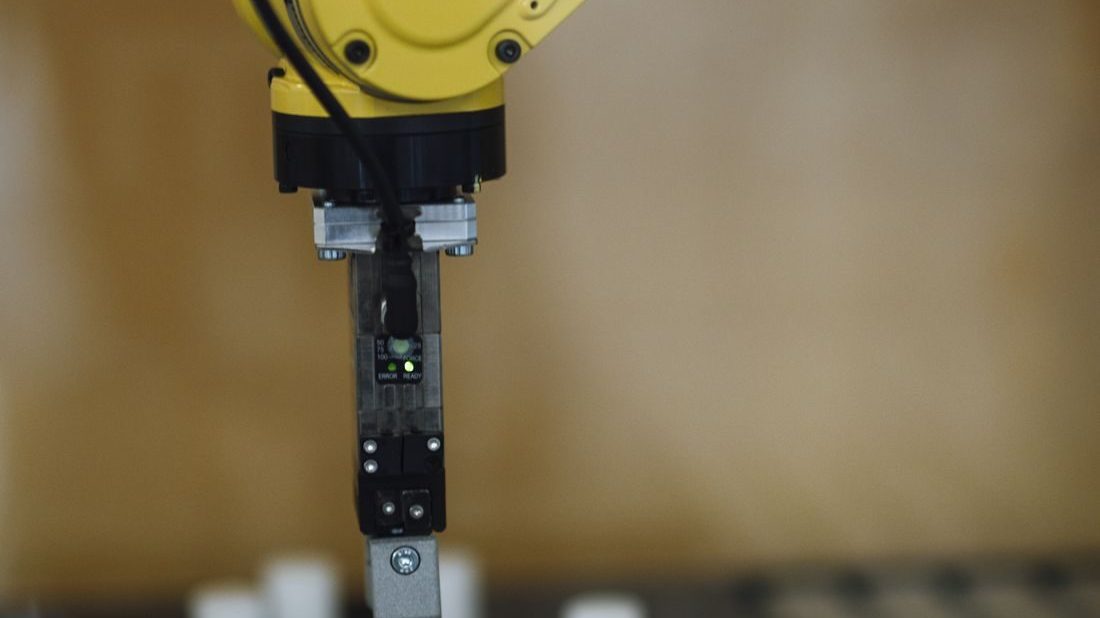 A robotic arm representing agentic AI systems that can plan and act