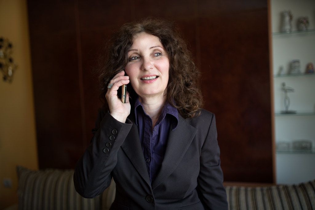 A BRC Web Helper team member on a phone call with a client