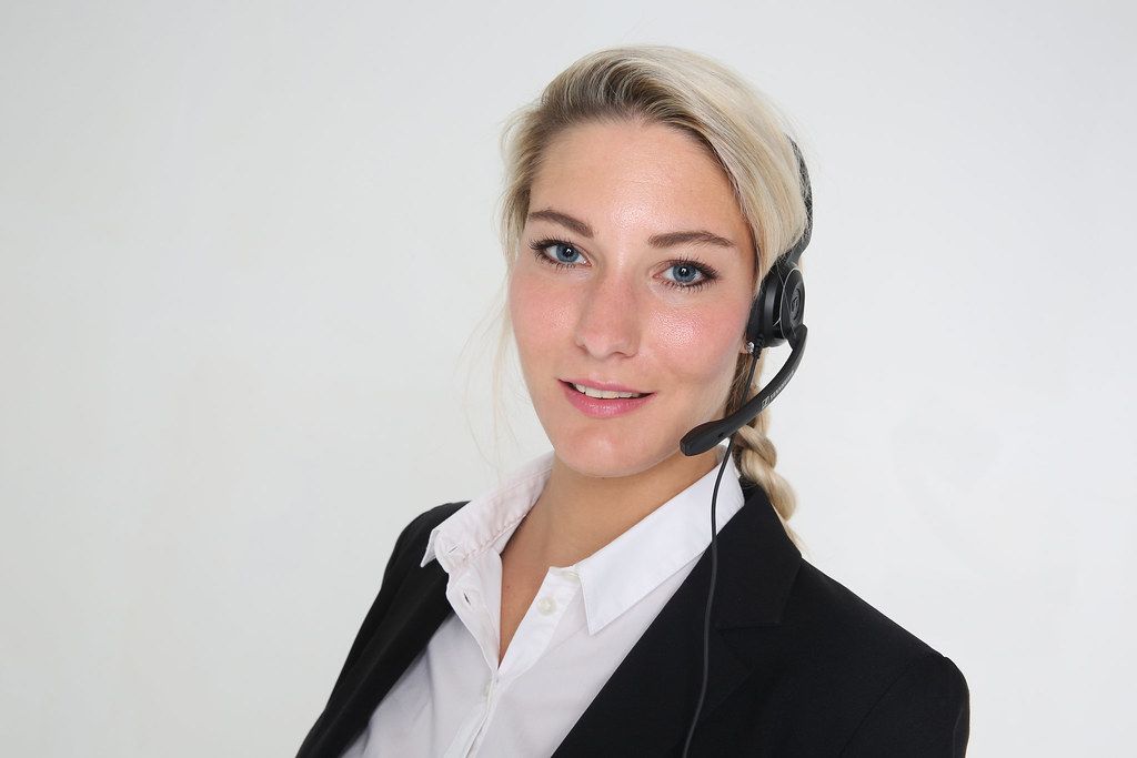A professional wearing a headset handling calls for a voice agent platform