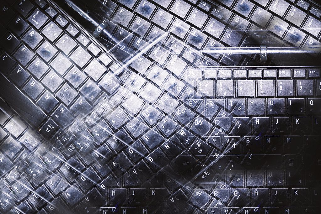 An abstract close-up of a keyboard representing our web, mobile, API, and data science services